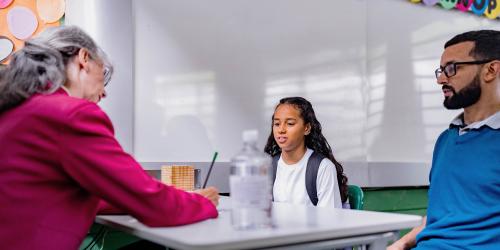 Student and parent talking to the principal